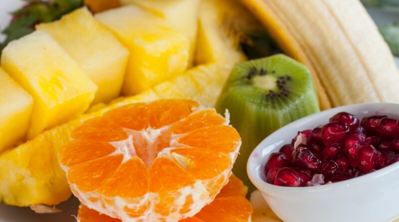 sliced orange fruit on white ceramic bowl