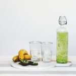 fruit juice and fruits on top of table