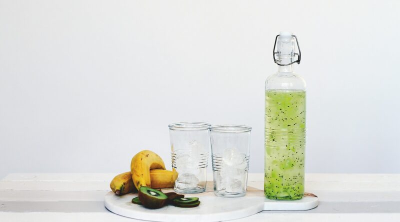 fruit juice and fruits on top of table