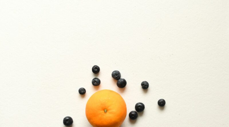 orange fruit on white surface